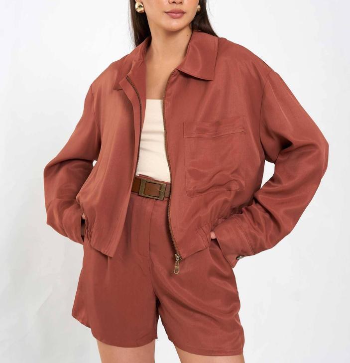 Model wearing a rust colored matching set